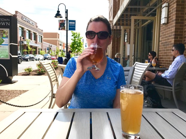 Marnay outside drinking refreshing local beers at Downtown Crown Wine and Beer