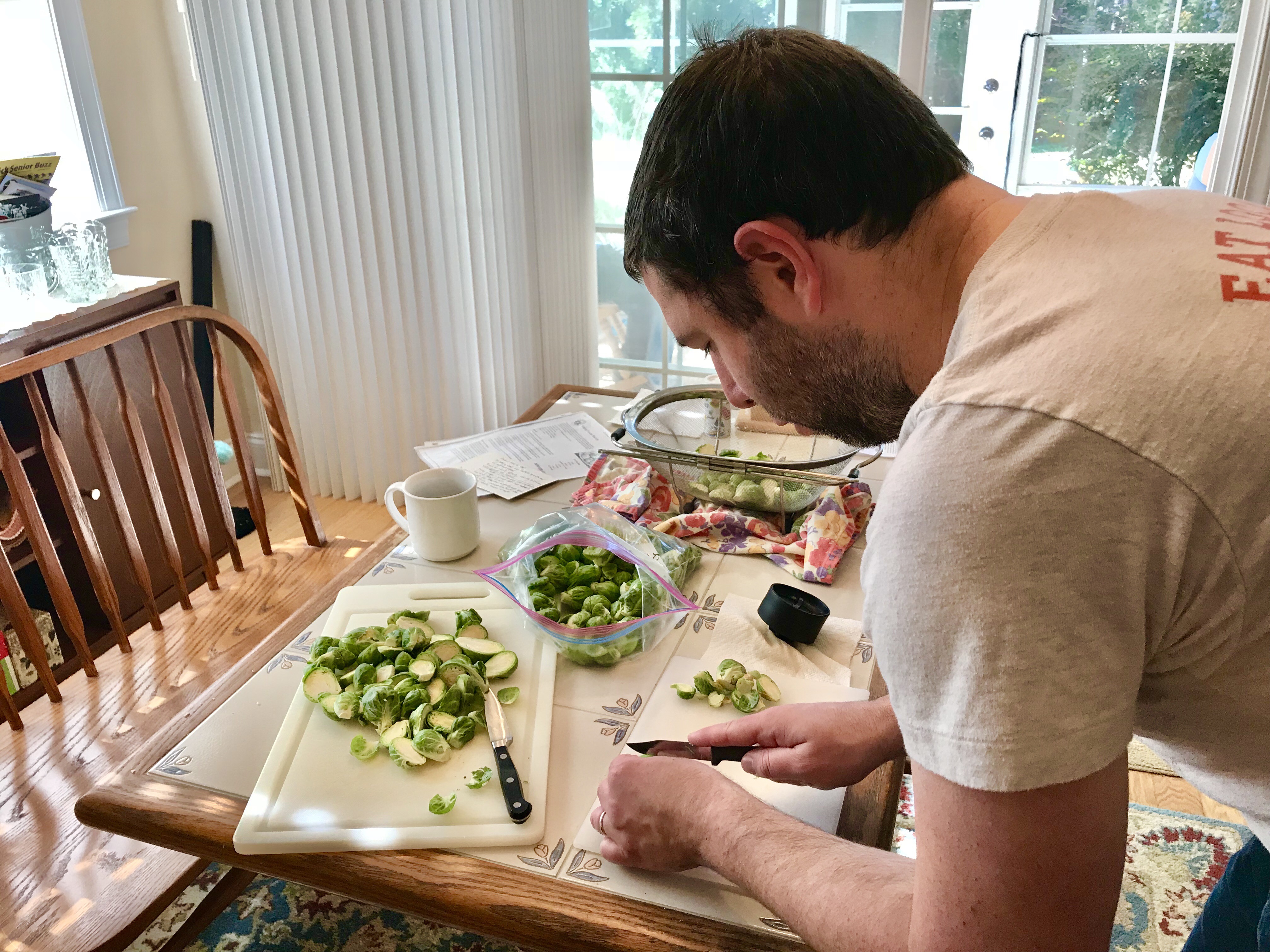 Meyer family thanksgiving: Paul cooking roasted brussels sprouts with cranberries and brown butter