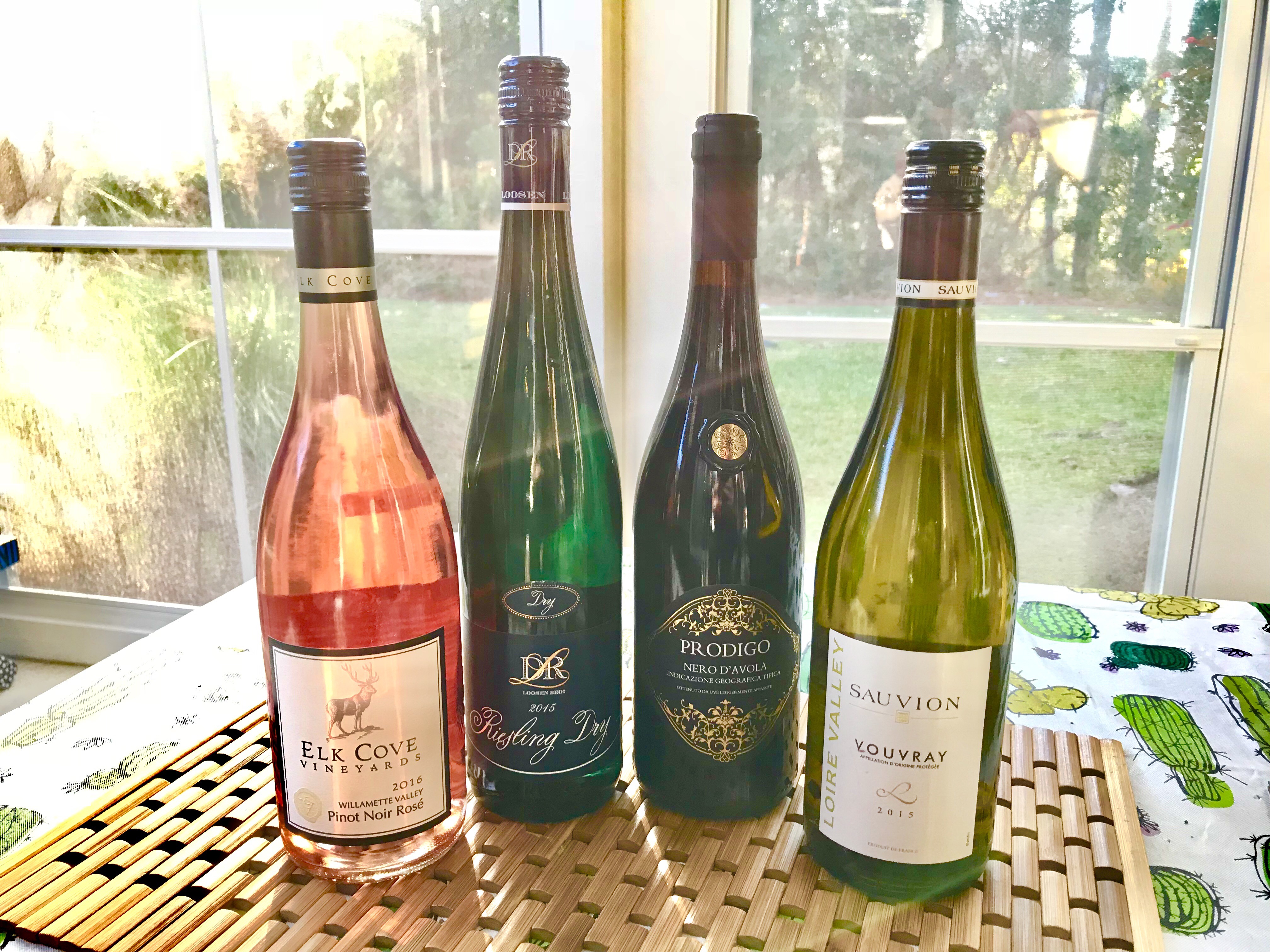 Meyer family thanksgiving: 2015 Loire Valley Chenin Blanc, 2015 dry Riesling from the Mosel Valley of Germany, 2016 rosé from the Willamette Valley and 2016 Nero d’Avola from Sicily wine bottles