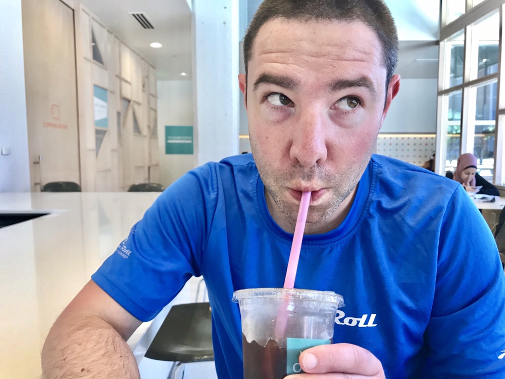Paul drinking coffee at New Order Coffee Roasters