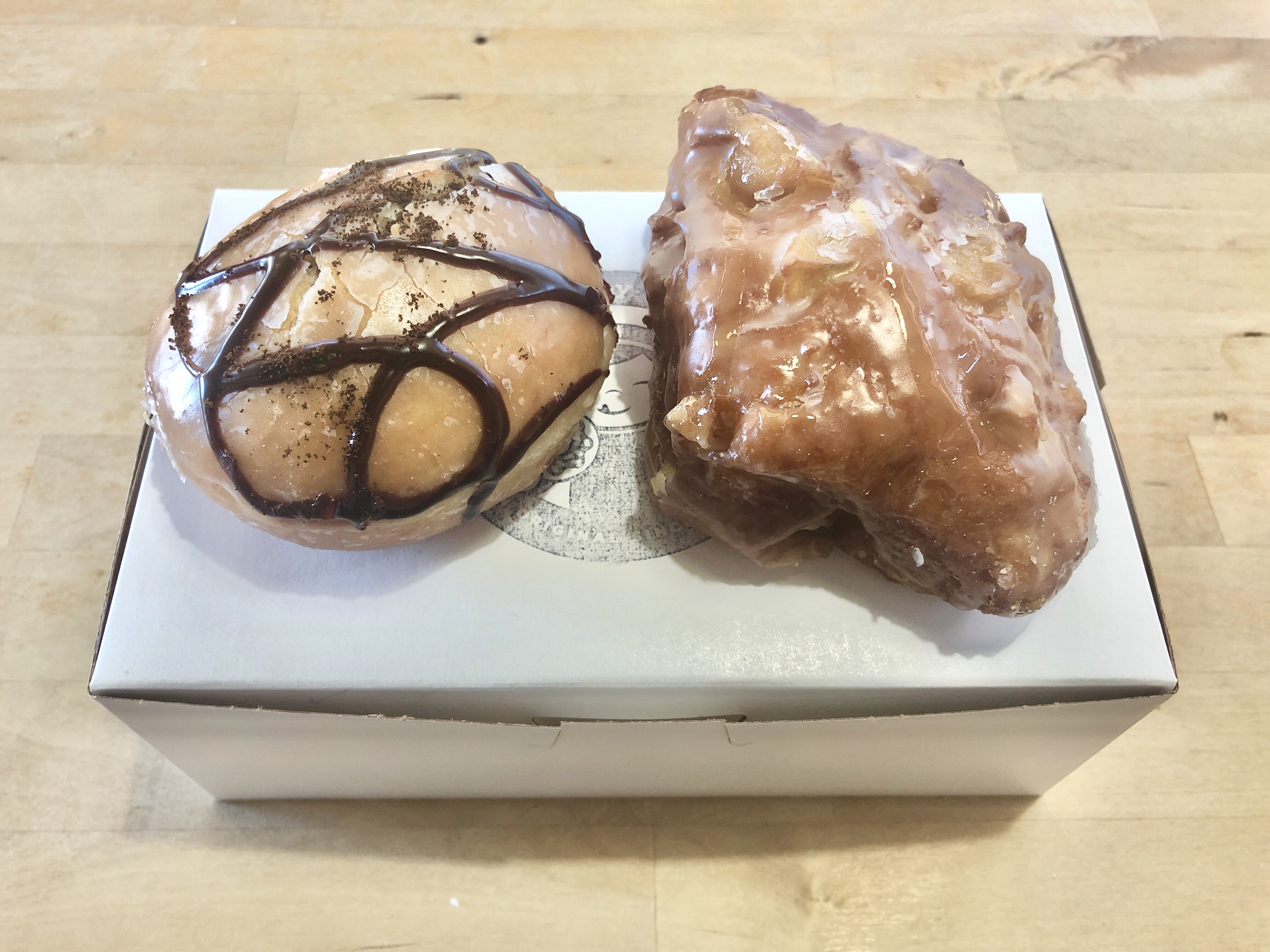 Eating a caramel apple fritter at Dutch Monkey Donuts in Forsyth County, Georgia