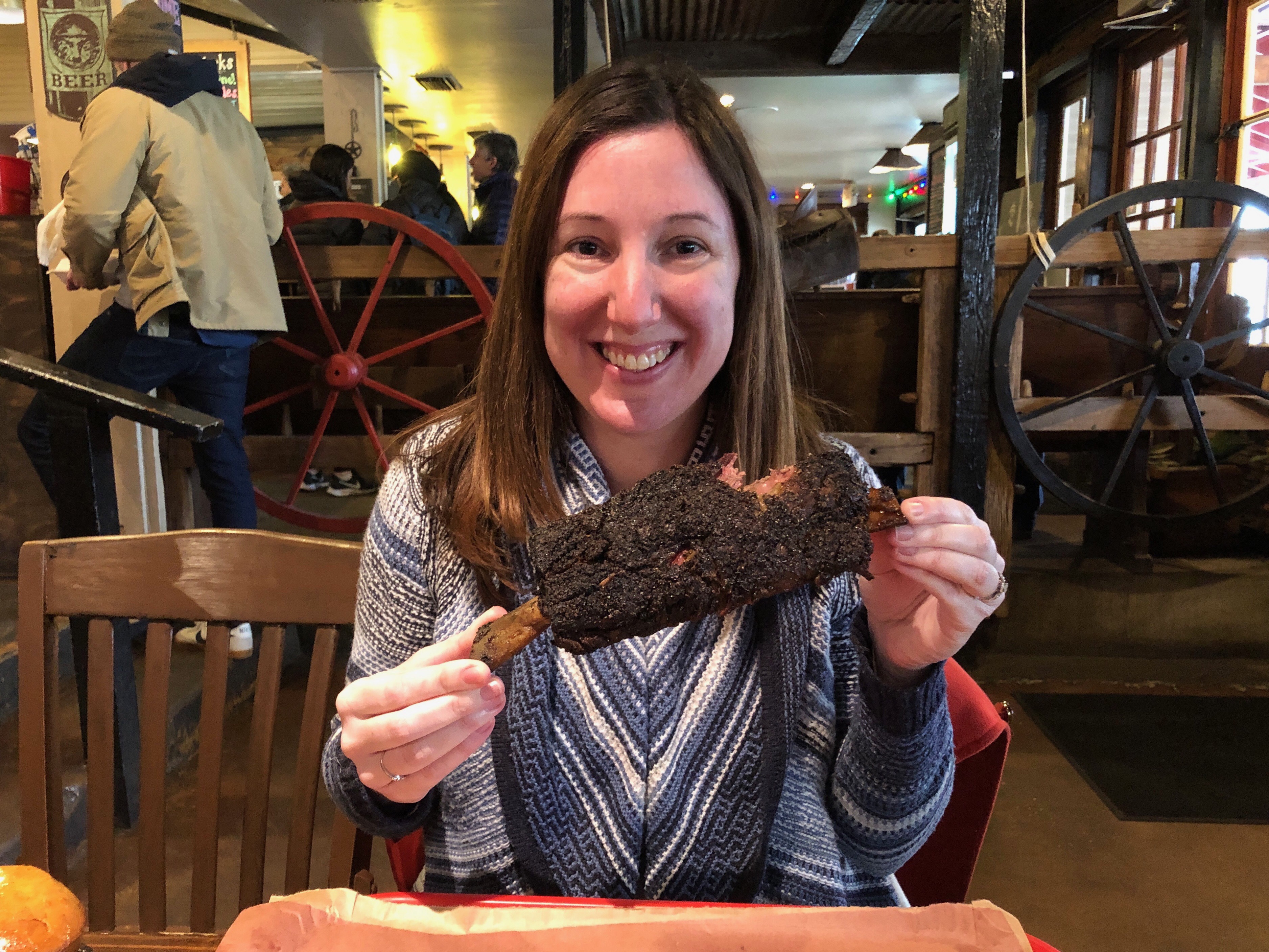 Marnay eating a giant beef rib at Terry Black’s Barbecue in Austin, Texas
